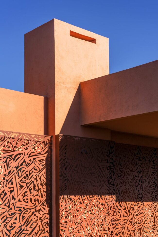 Exterior view of the calligraphic mashrabiyya work on laser-cut corten steel panels in a private villa in Rabat, Morocco